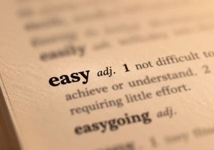 Close-up of a dictionary entry for the word easy
